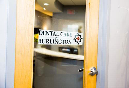 Front door with the Dental Care of Burlington logo