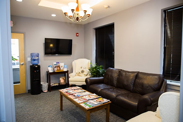 The front lobby and waiting room at Dental Care of Burlington in Burlington, MA.