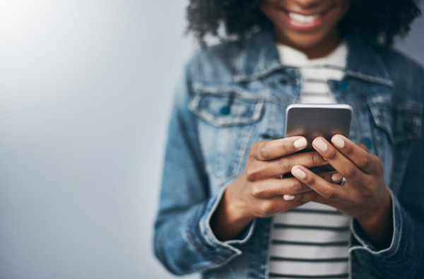 Woman looking at website on her phone.